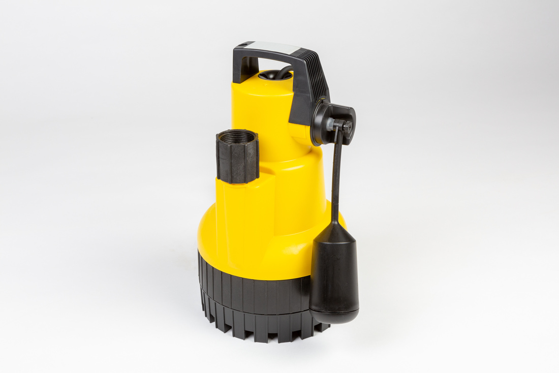 Submersible drainage pump for clear swimming pool water on a grey background.